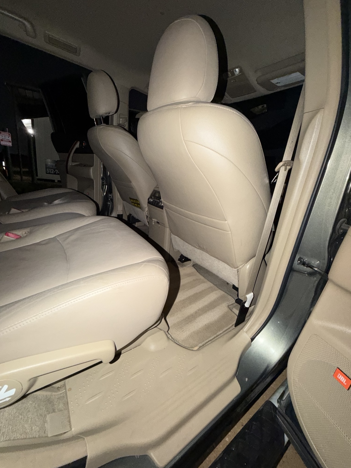 Clean beige rear leather seats and floor mats